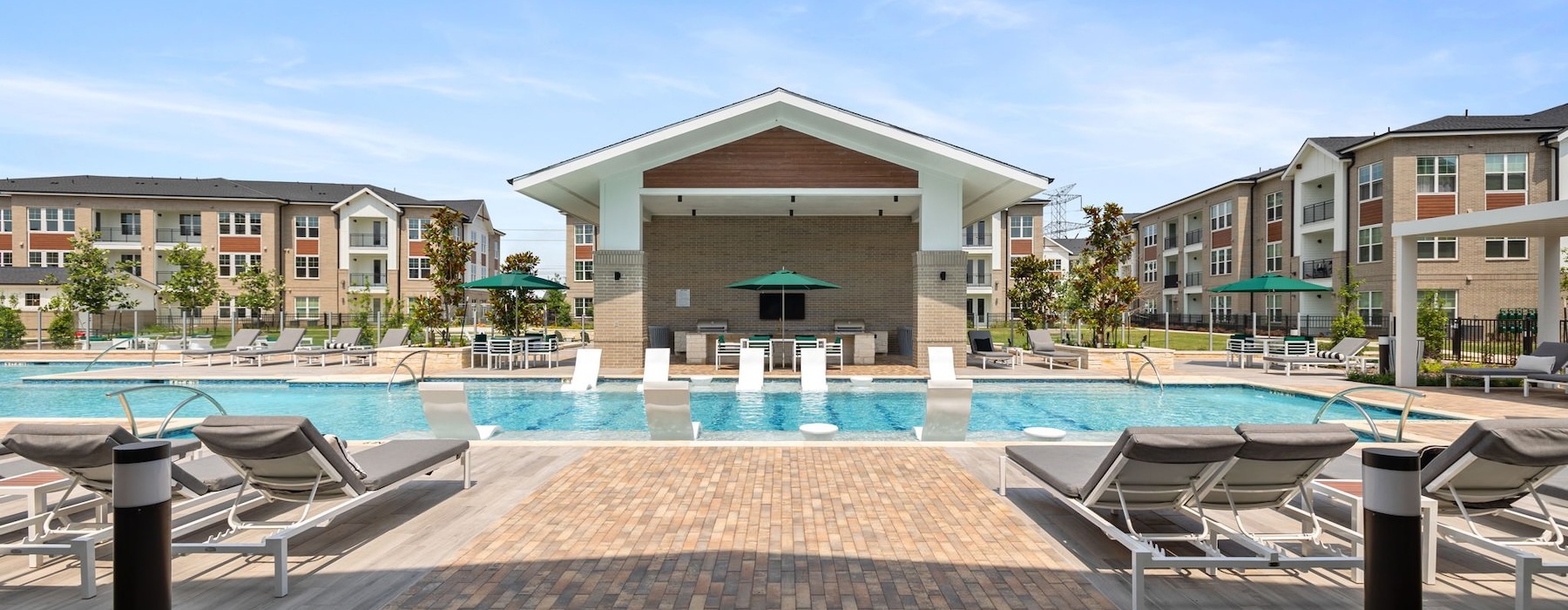 a swimming pool with a building in the background