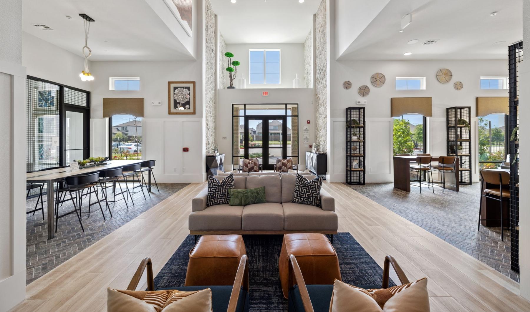 a living room with a large glass door and a dining table