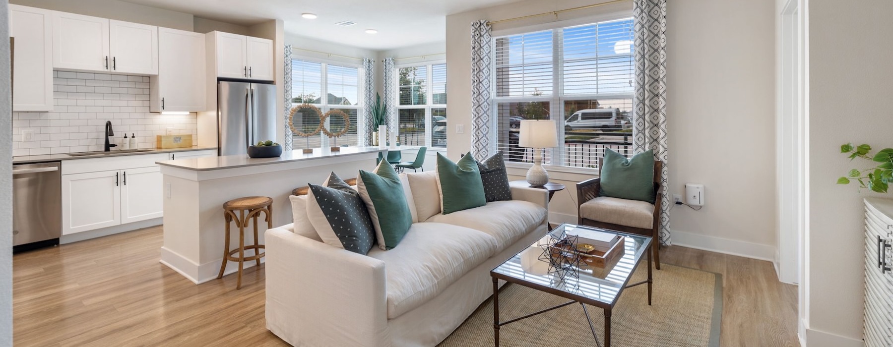 a living room with a white couch and a table