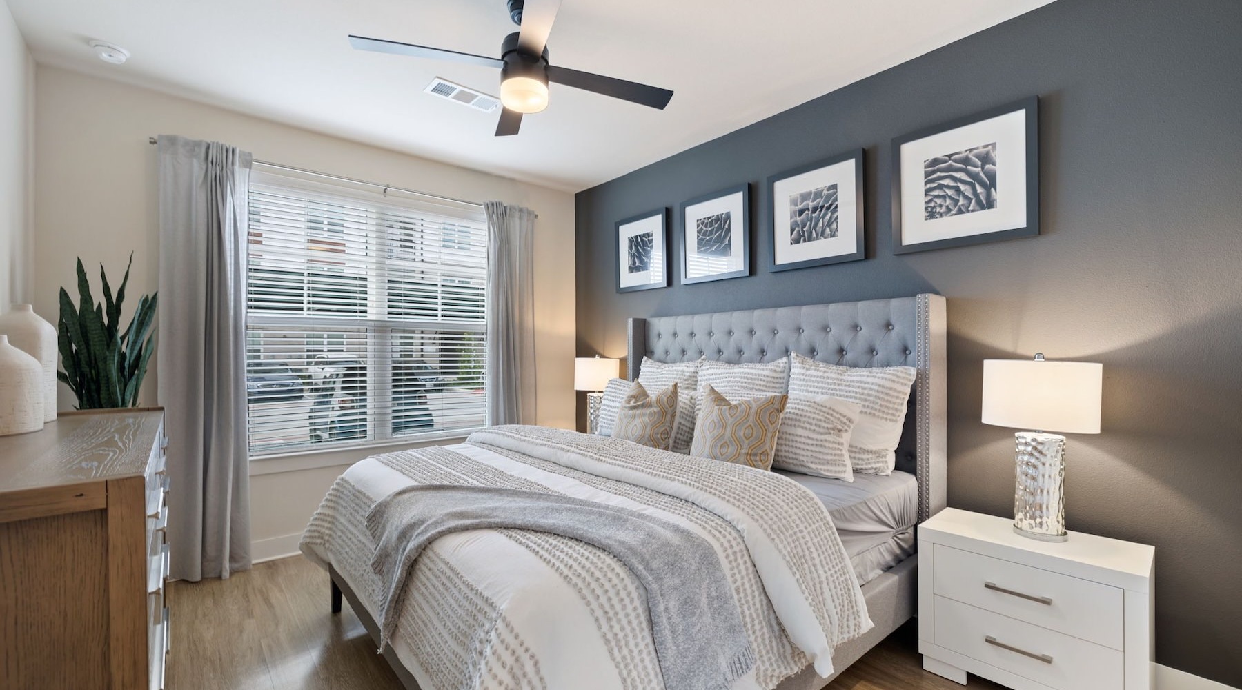 a bedroom with a bed and two nightstands